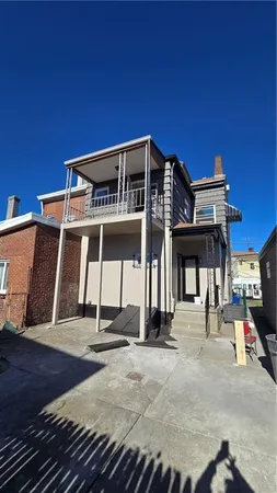 a front view of a building with parking