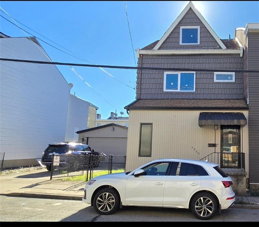 4560 Friendship Avenue Pittsburgh, PA 15224 - Photo 2 of 20 a car parked in front of a house