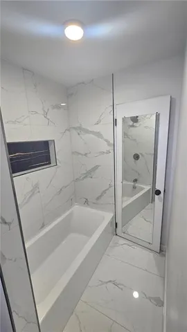 a bathroom with a bathtub