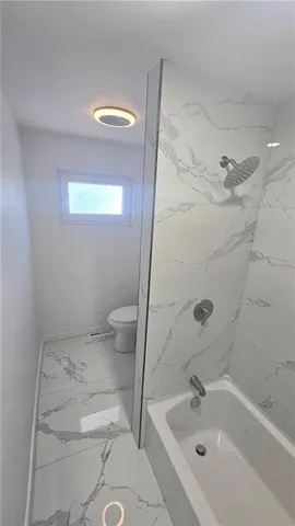 a bathroom with a sink and toilet
