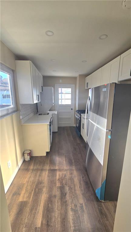 4560 Friendship Avenue Pittsburgh, PA 15224 - Photo 10 of 20 a kitchen with a refrigerator sink and cabinets