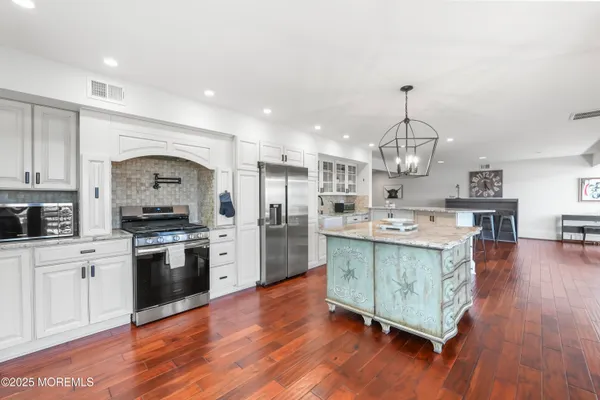 a bedroom with a large bed and a large window