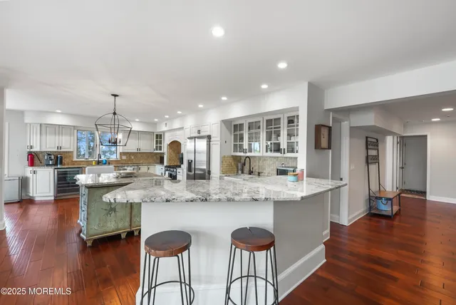a bedroom with a bed window and a ceiling fan