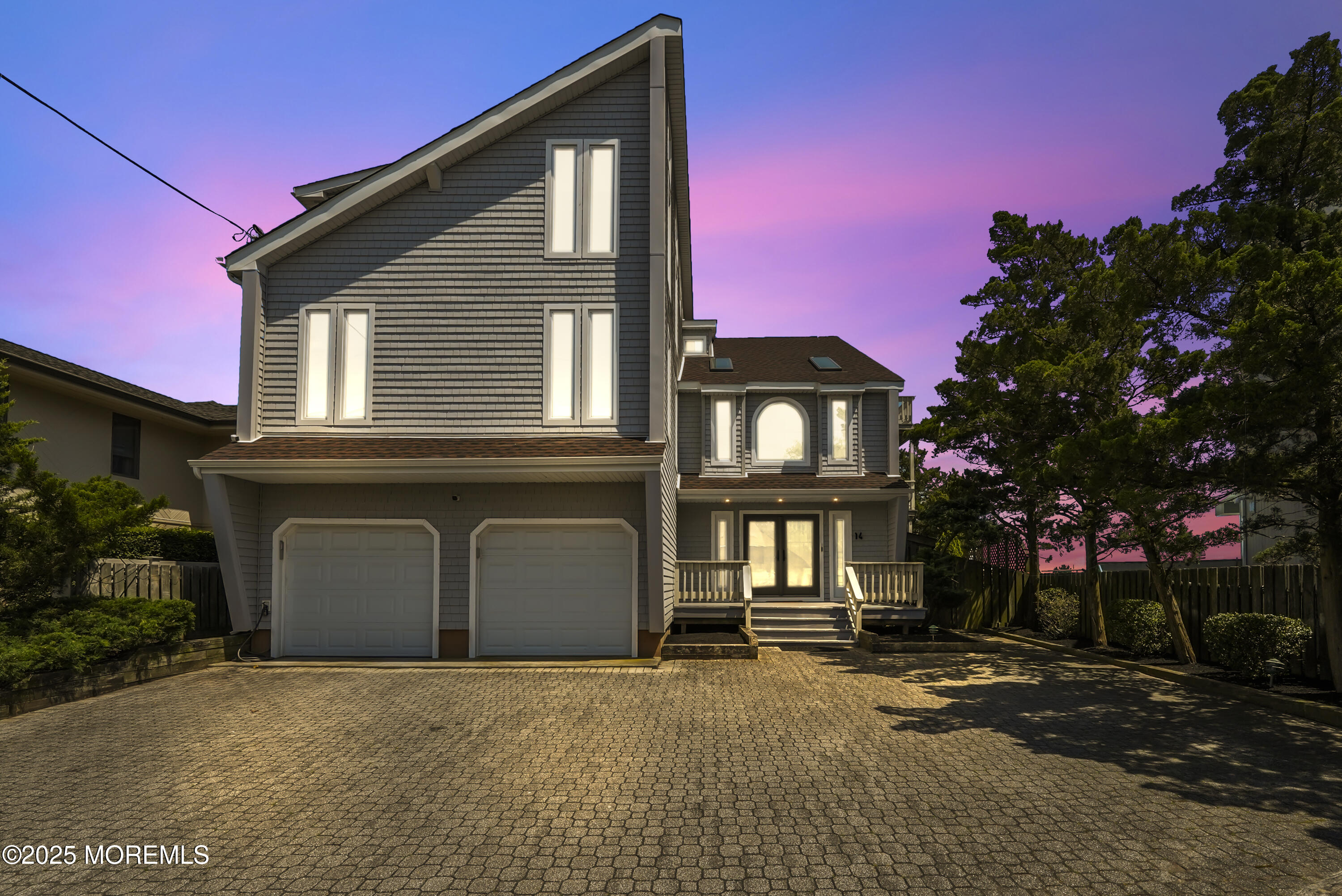 14 Toledo Drive Brick, NJ 08723 - Photo 2 of 75 a front view of a house with a yard and garage