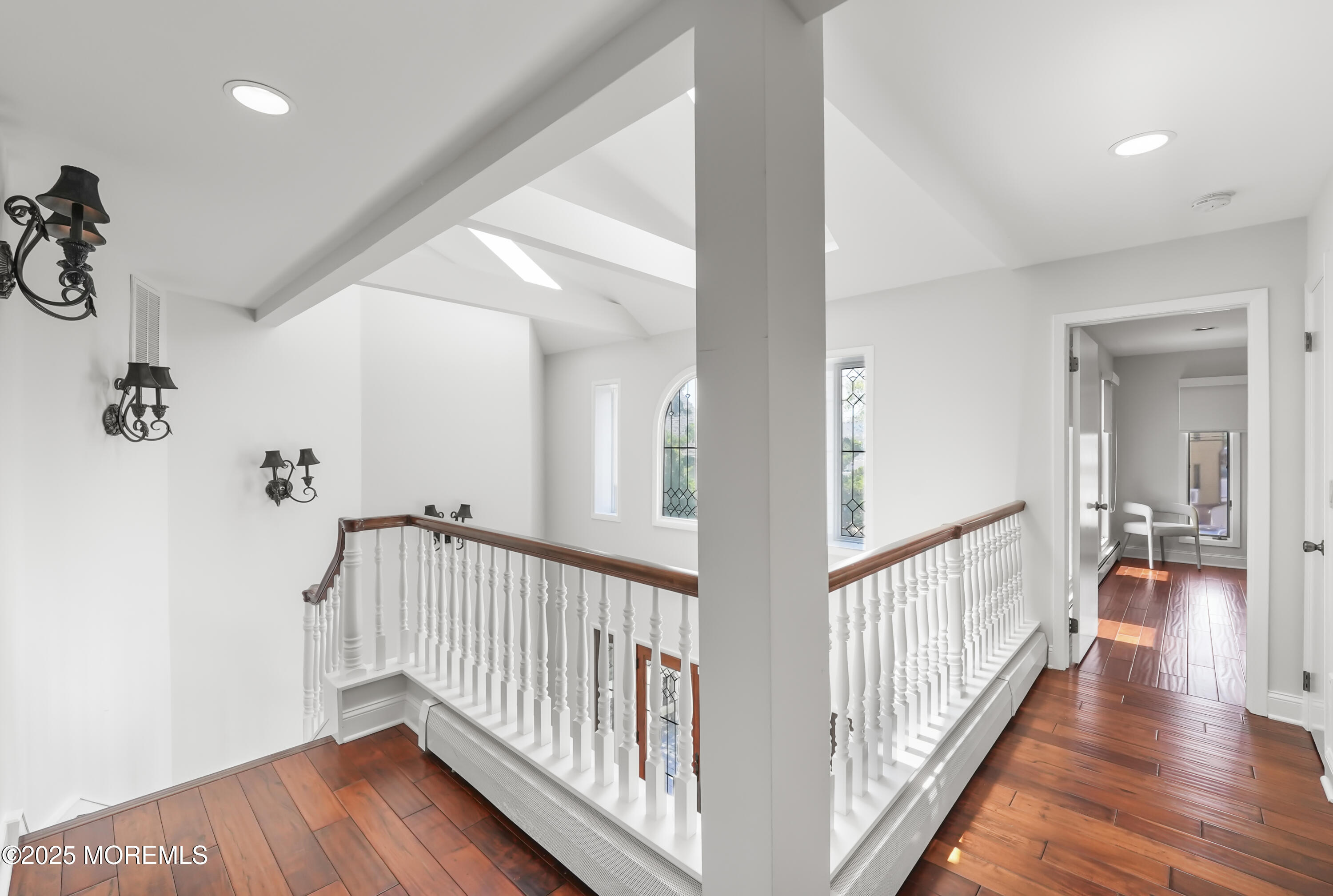 14 Toledo Drive Brick, NJ 08723 - Photo 28 of 75 a view of a hallway with wooden floor and stairs