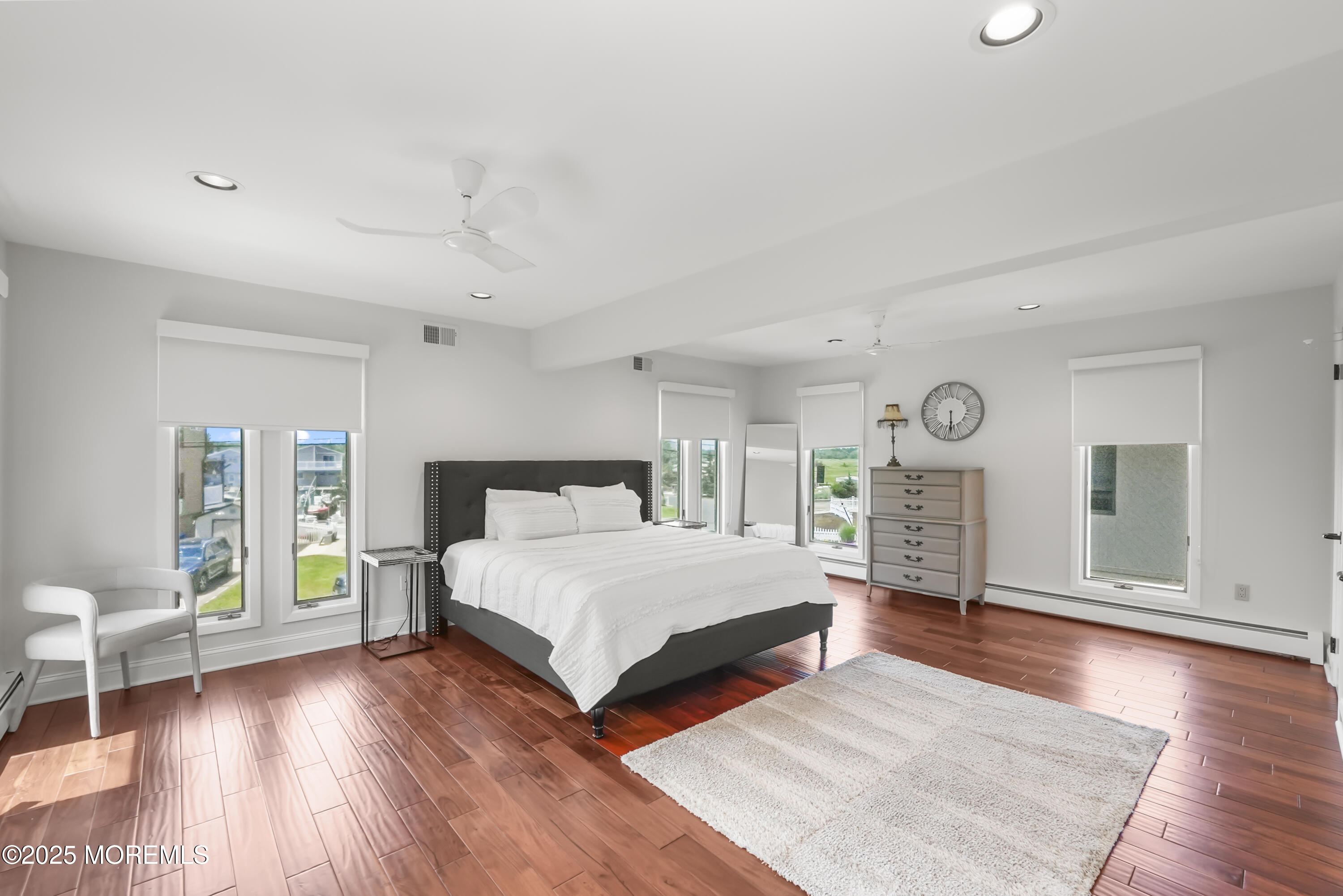 14 Toledo Drive Brick, NJ 08723 - Photo 37 of 75 a spacious bedroom with a large bed and a wooden floor