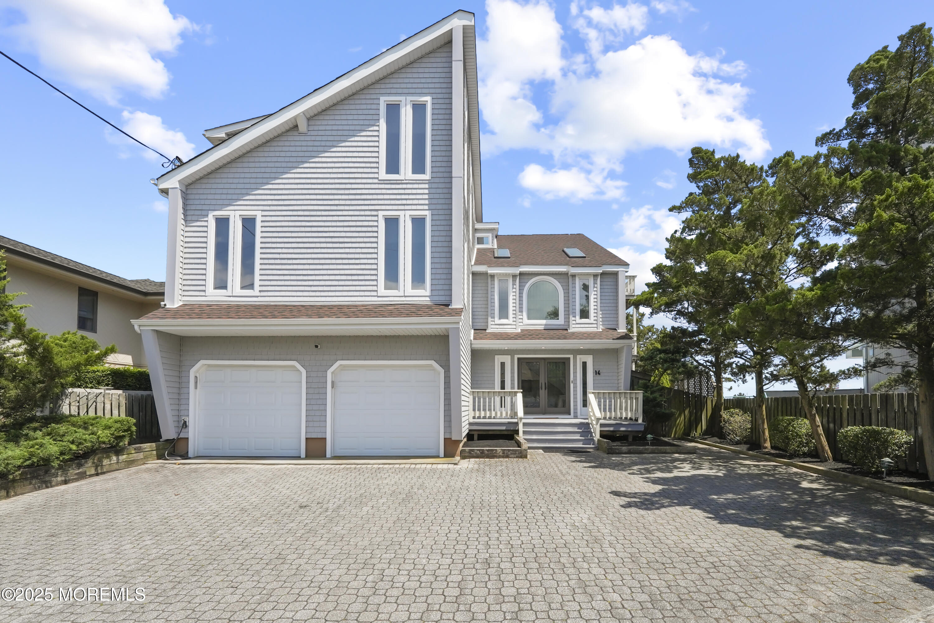 14 Toledo Drive Brick, NJ 08723 - Photo 4 of 75 a front view of a house with a yard and garage
