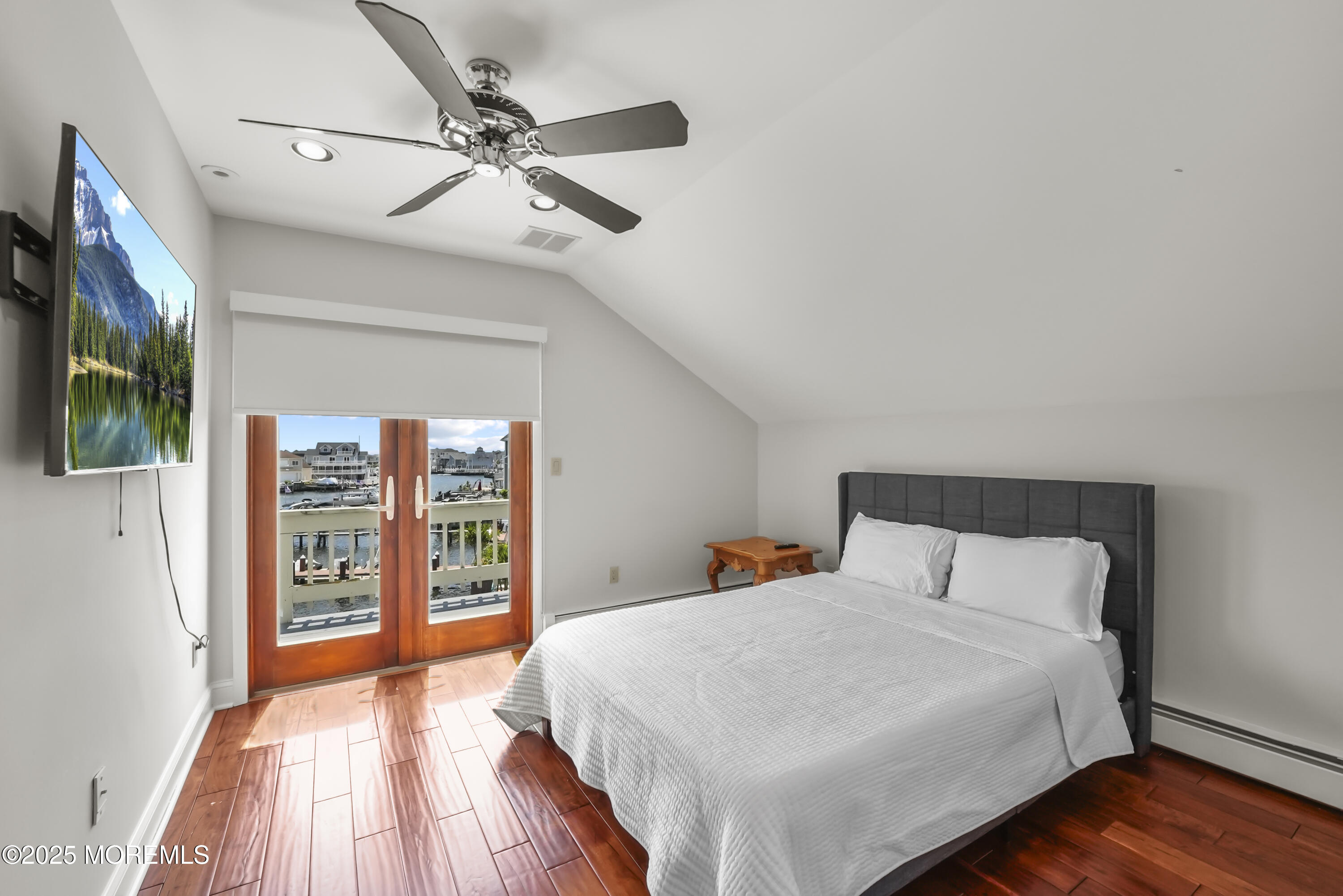 14 Toledo Drive Brick, NJ 08723 - Photo 41 of 75 a bedroom with a large bed and a flat tv screen on dresser