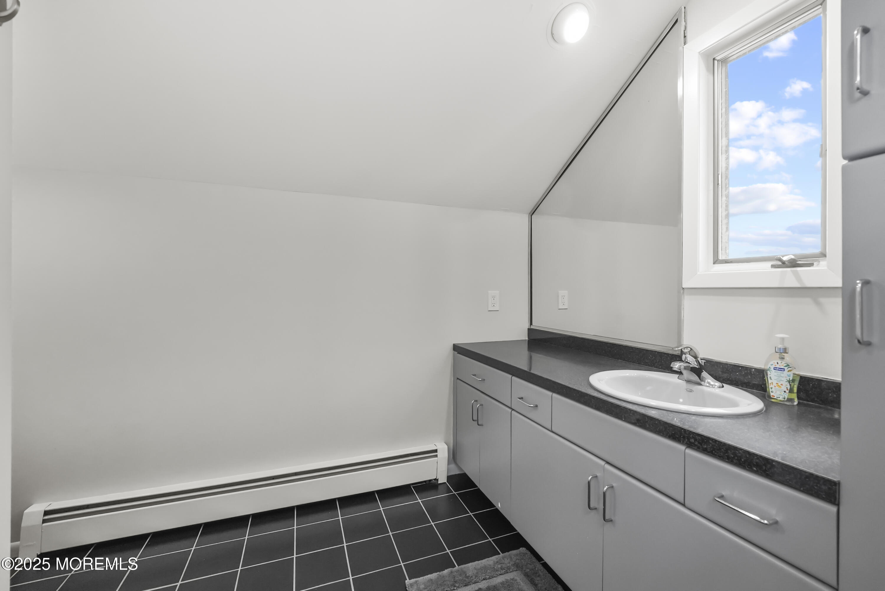 14 Toledo Drive Brick, NJ 08723 - Photo 45 of 75 a bathroom with a granite countertop sink and a mirror