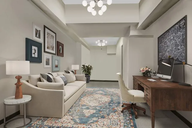 a living room with furniture a chandelier and a dining table