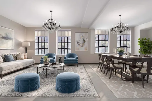 a living room with fireplace furniture and a chandelier