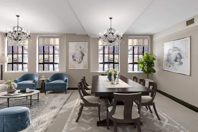 a view of a dining room with furniture a chandelier and wooden floor