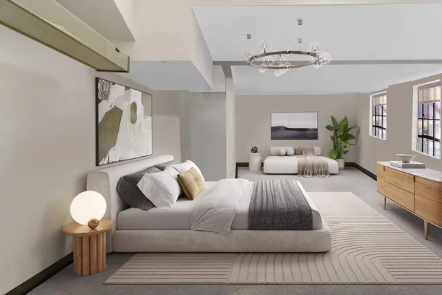 a spacious bedroom with a bed and window