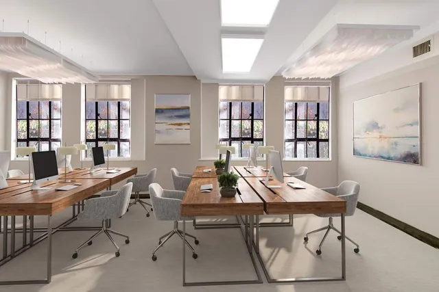 a workspace with furniture and window