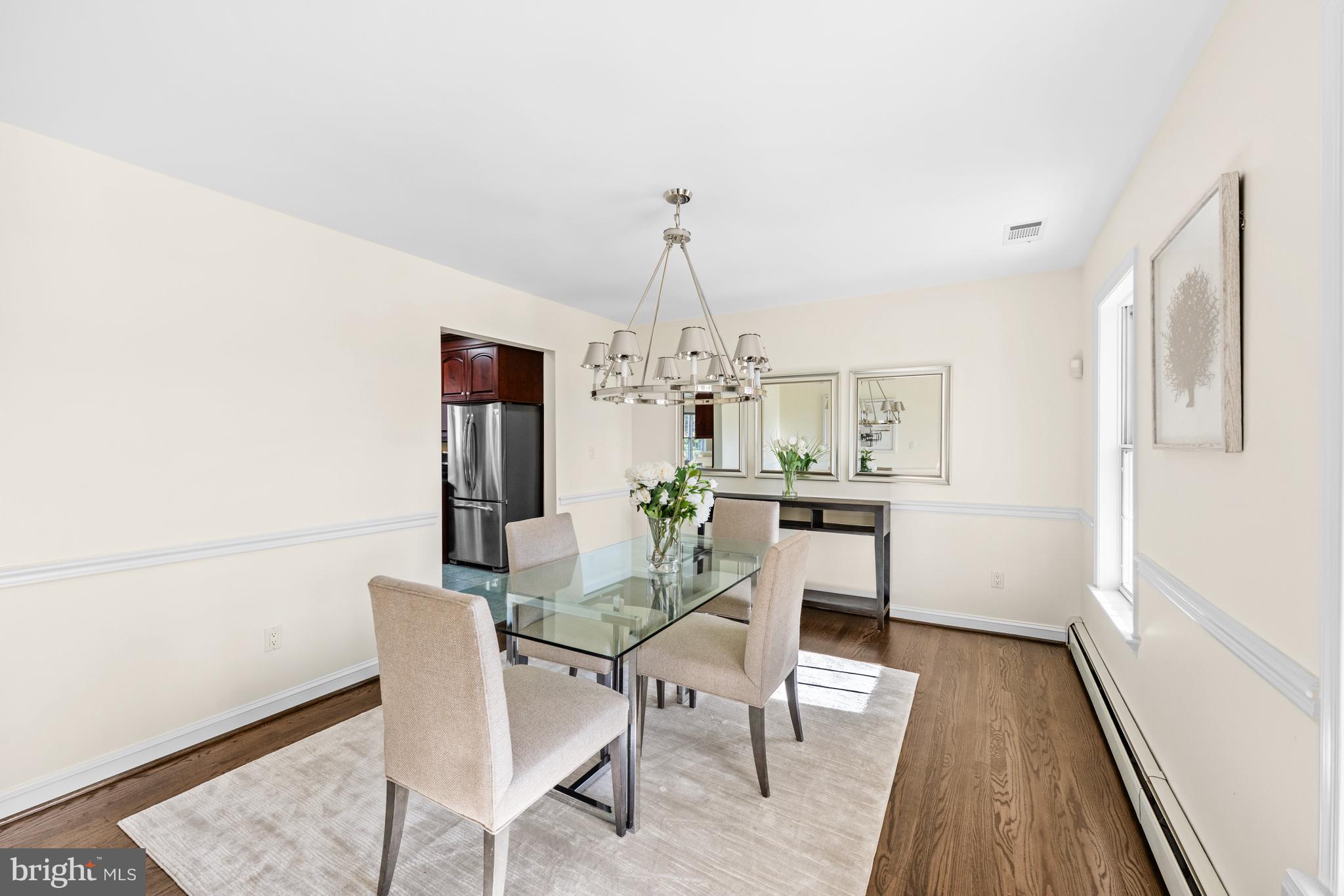 4807 Bready Road Rockville, MD 20853 - Photo 11 of 44 a dining room with furniture and wooden floor