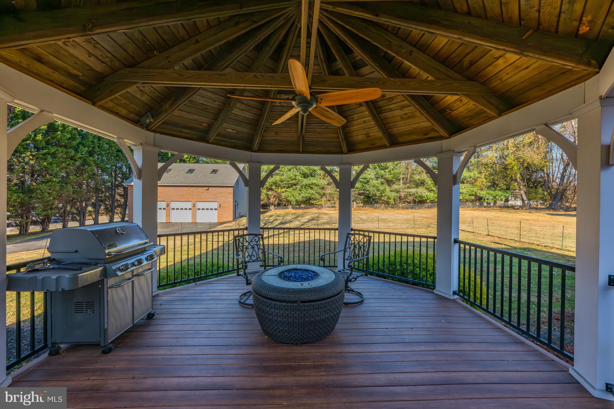 4807 Bready Road Rockville, MD 20853 - Photo 17 of 44 a view of a deck yard with a table and chairs