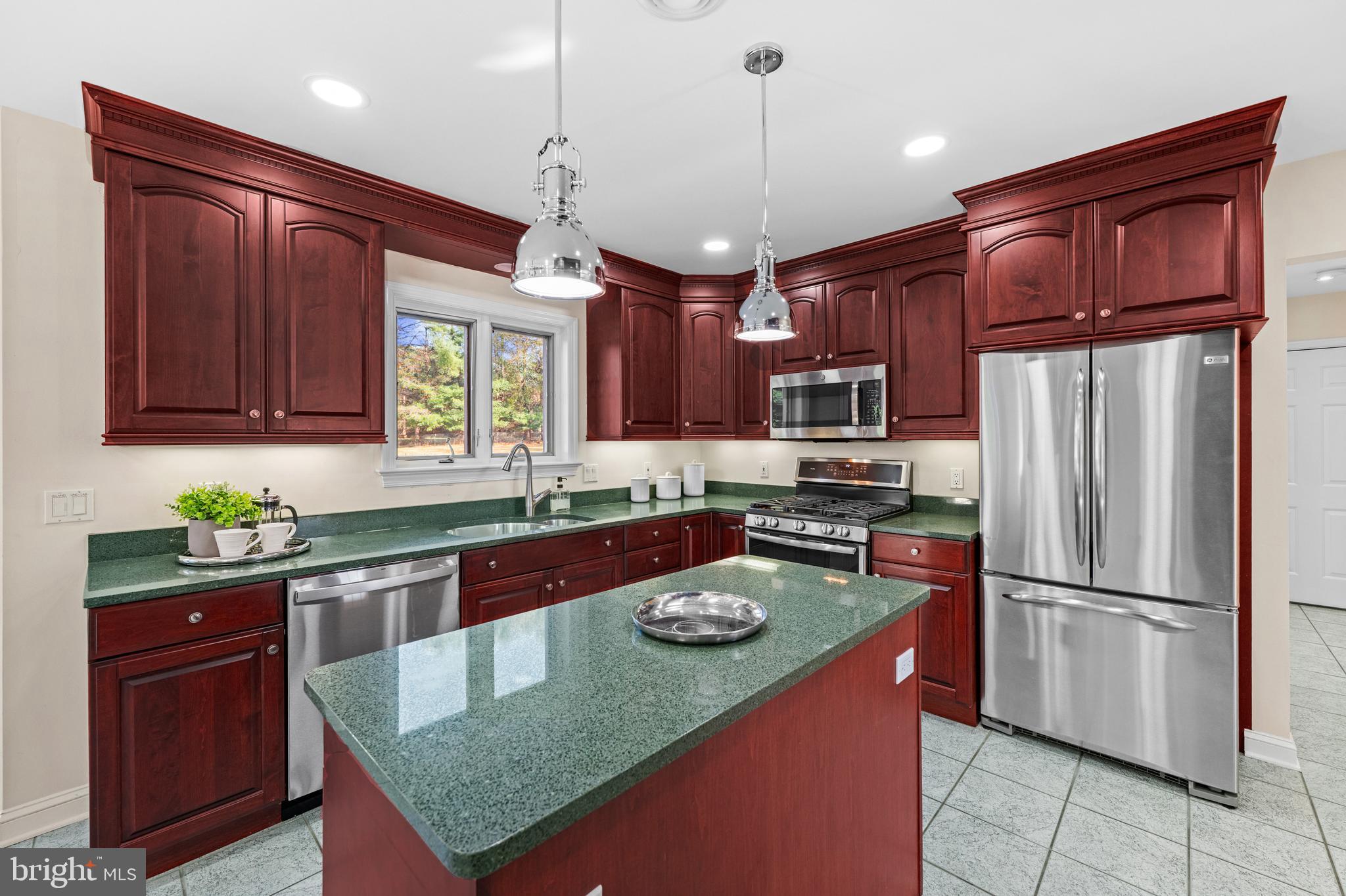 4807 Bready Road Rockville, MD 20853 - Photo 20 of 44 a kitchen with stainless steel appliances granite countertop a refrigerator a sink dishwasher a stove and a refrigerator