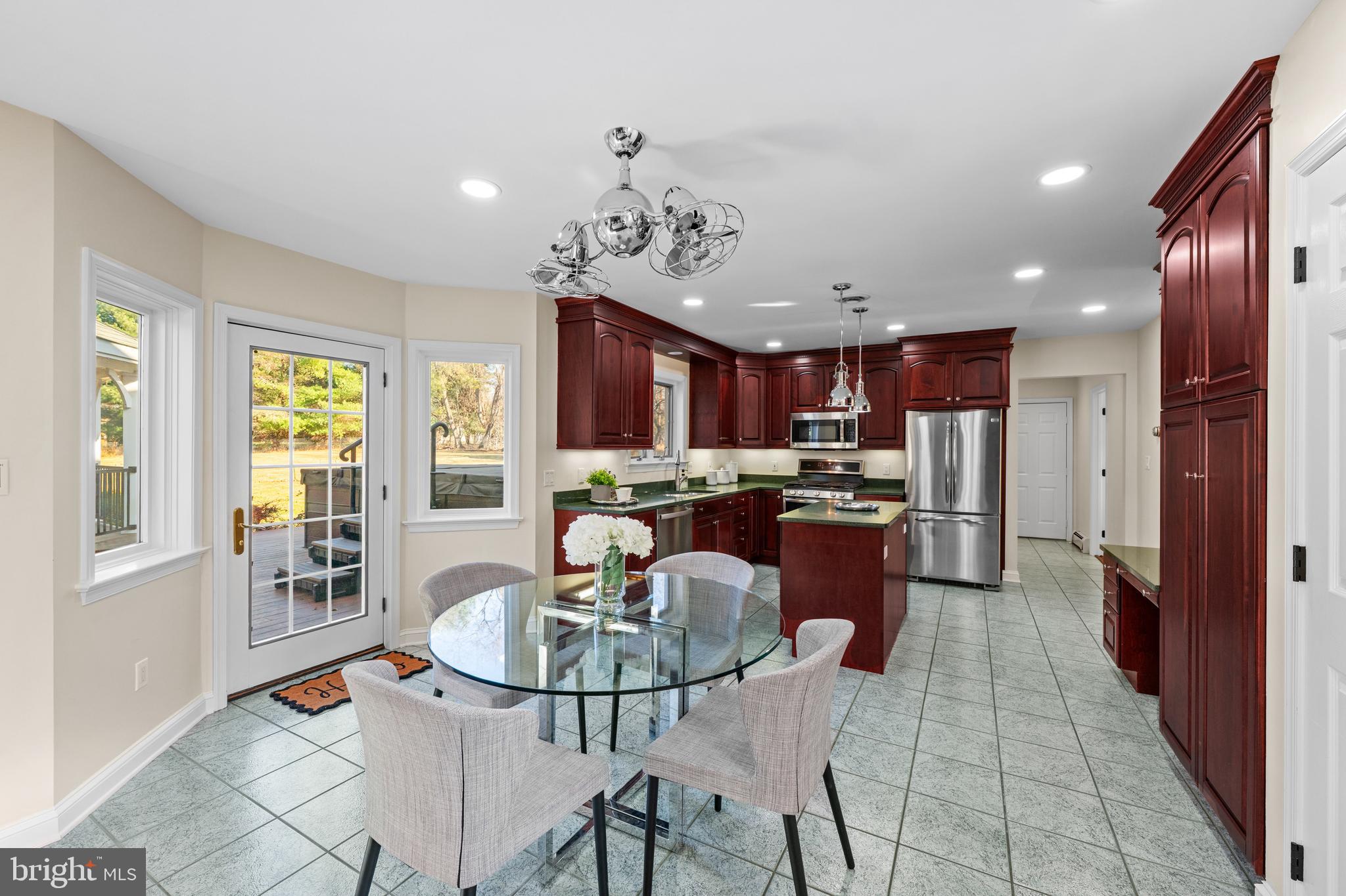 4807 Bready Road Rockville, MD 20853 - Photo 22 of 44 a kitchen with a table and chairs