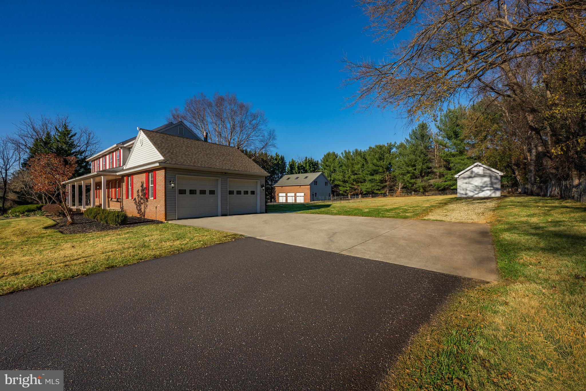 4807 Bready Road Rockville, MD 20853 - Photo 39 of 44 a front view of a house with a yard and garage