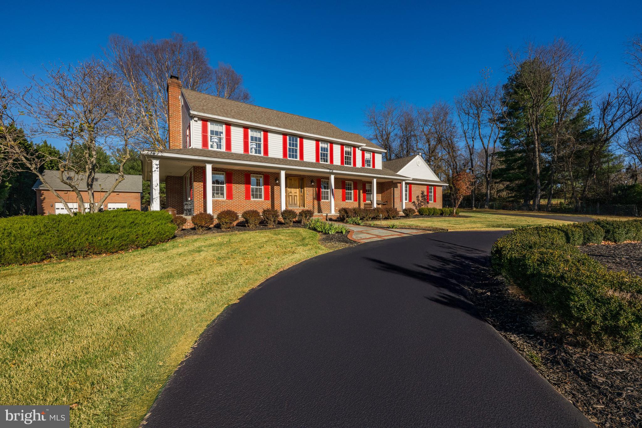 4807 Bready Road Rockville, MD 20853 - Photo 4 of 44 a front view of a residential apartment building with a yard