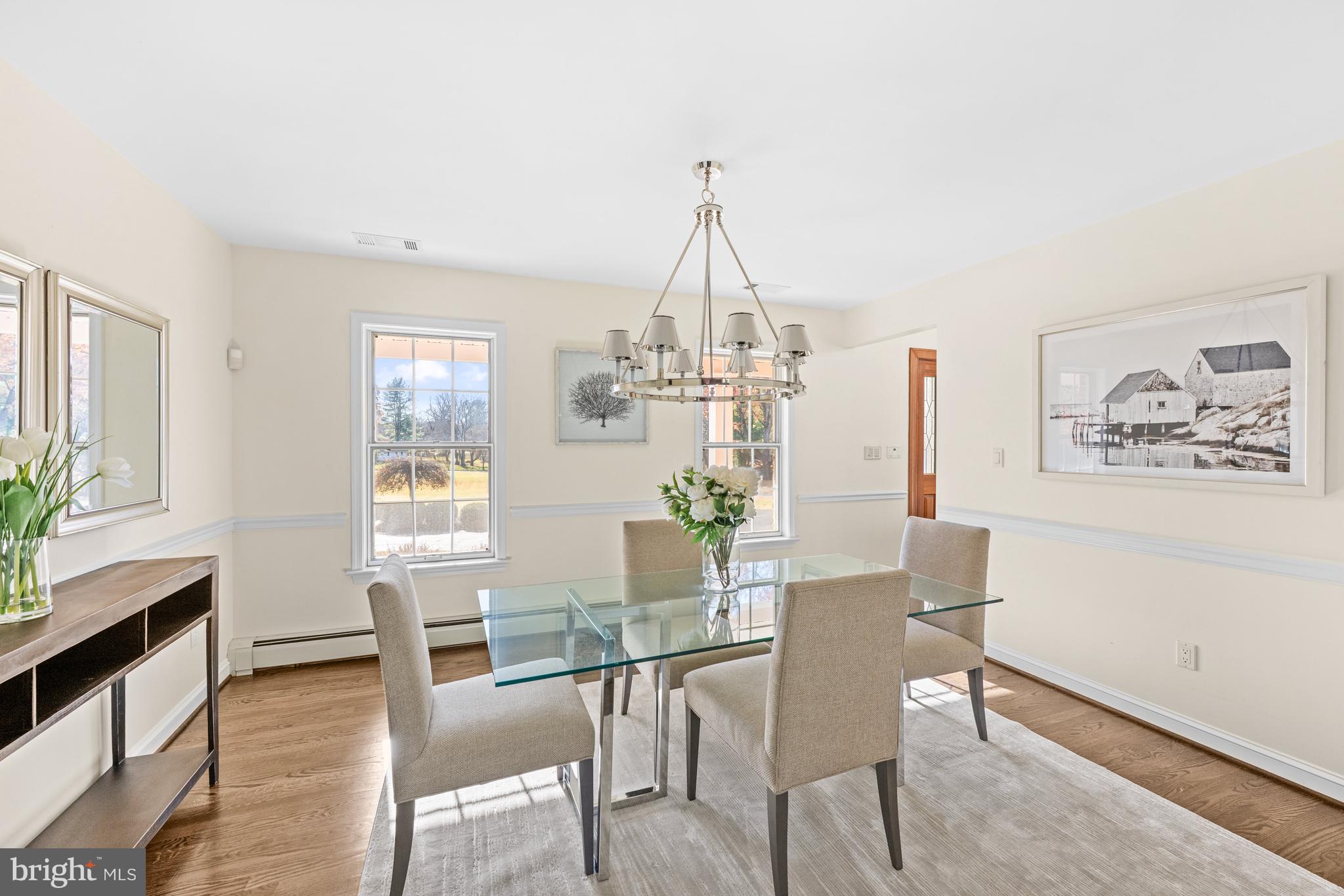 4807 Bready Road Rockville, MD 20853 - Photo 10 of 44 a view of a dining room with furniture window and wooden floor