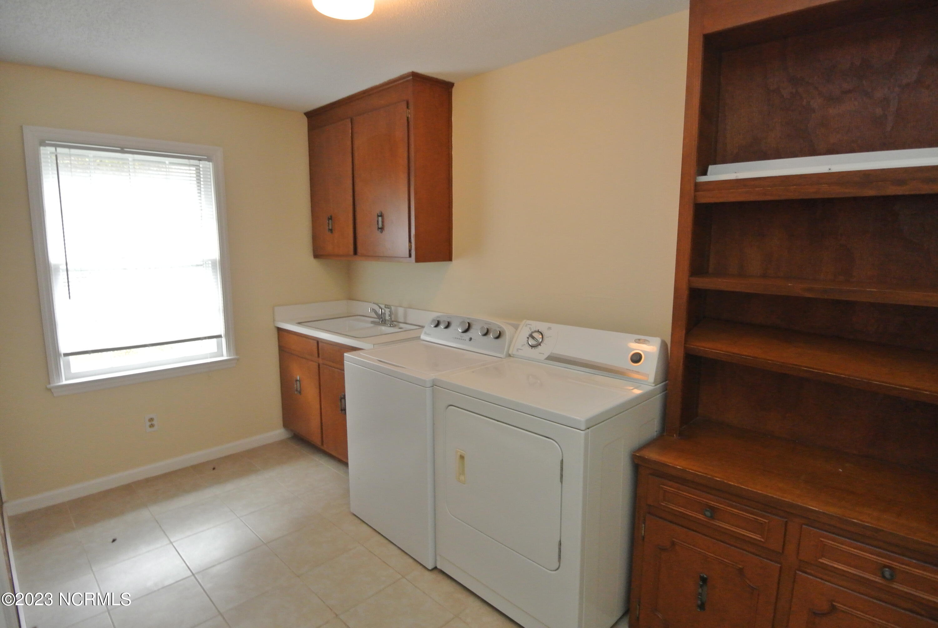 2129 Neuse Cliffs Circle New Bern, NC 28560 - Photo 24 of 27 Laundry room off of carport