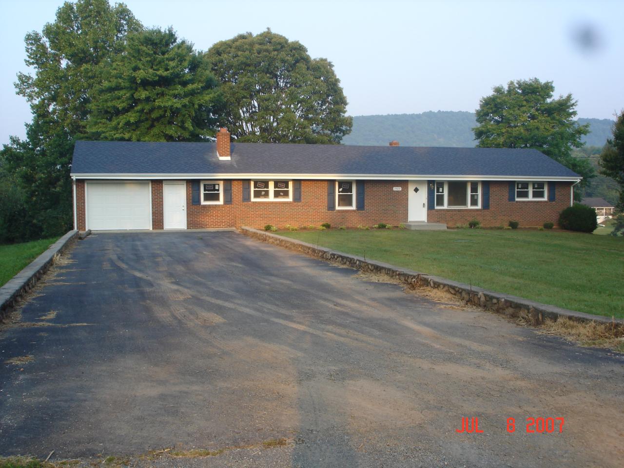 7469 Hardy Road Hardy, VA 24101 - Photo 1 of 7 front view of a house and a yard