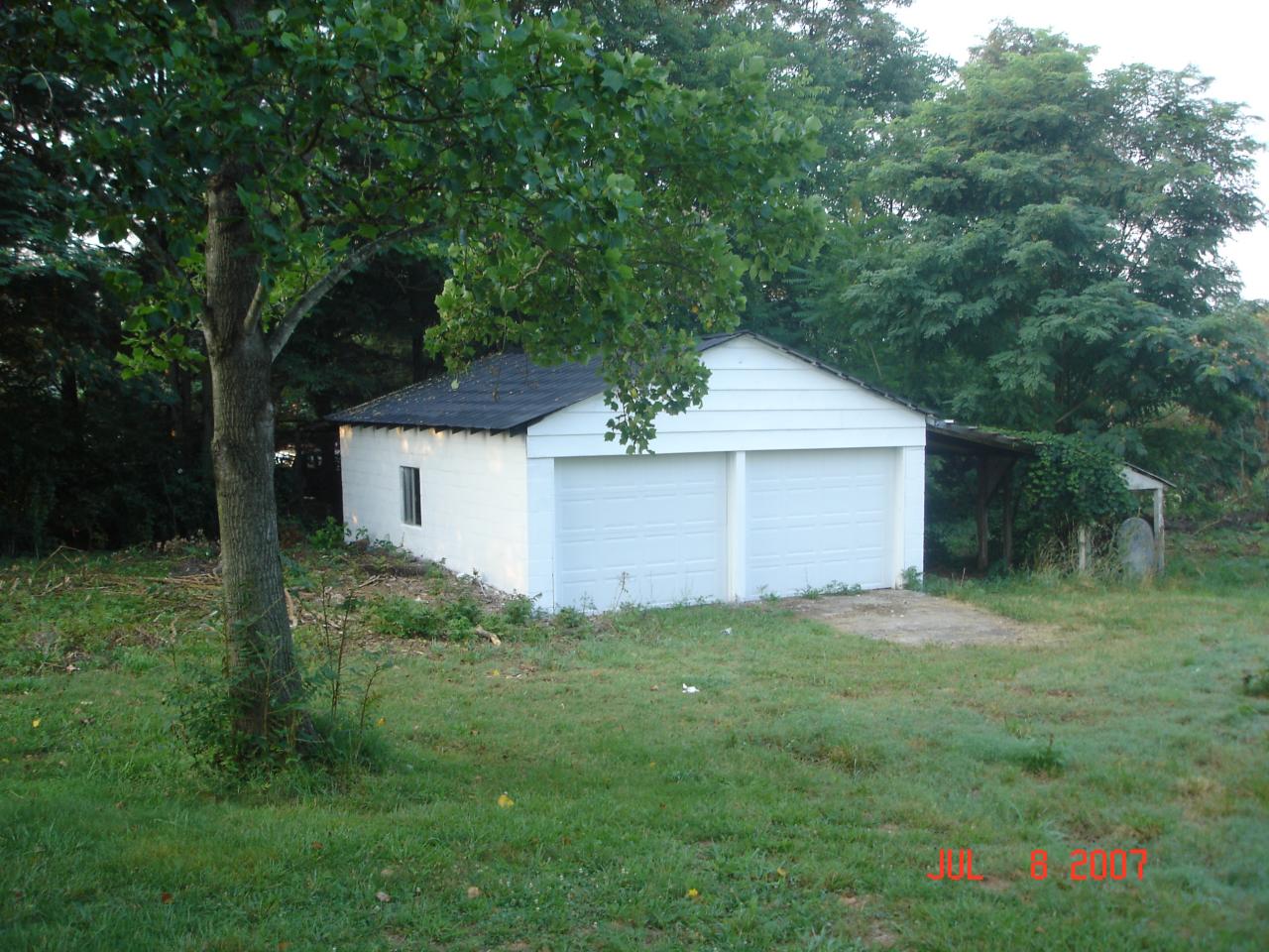 7469 Hardy Road Hardy, VA 24101 - Photo 6 of 7 a front view of a house with a yard and trees