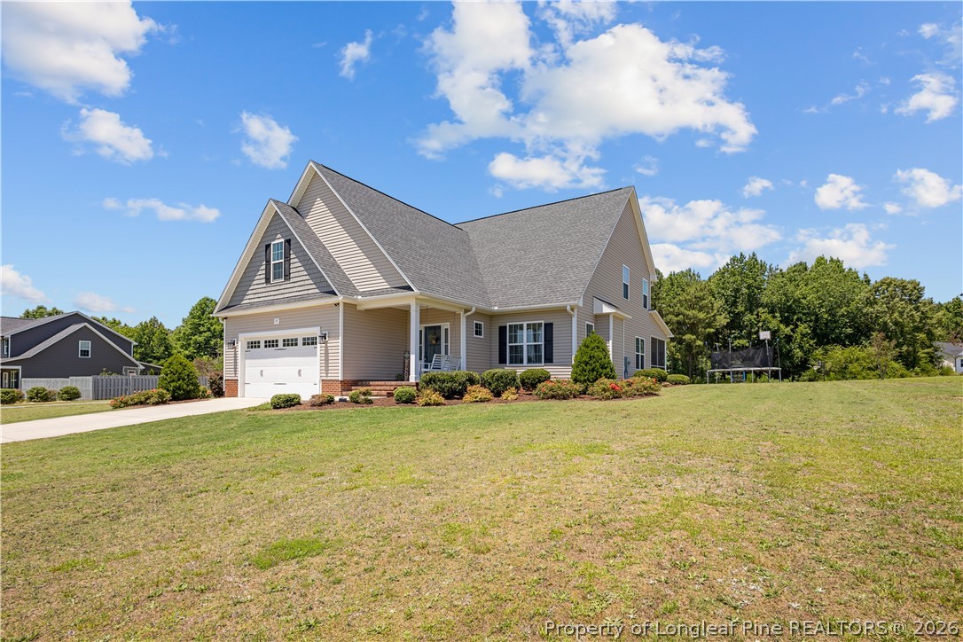 137 Minter School Road Sanford, NC 27332 - Photo 42 of 50 a view of a house with a yard and entertaining space