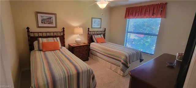 a bedroom with bed and window