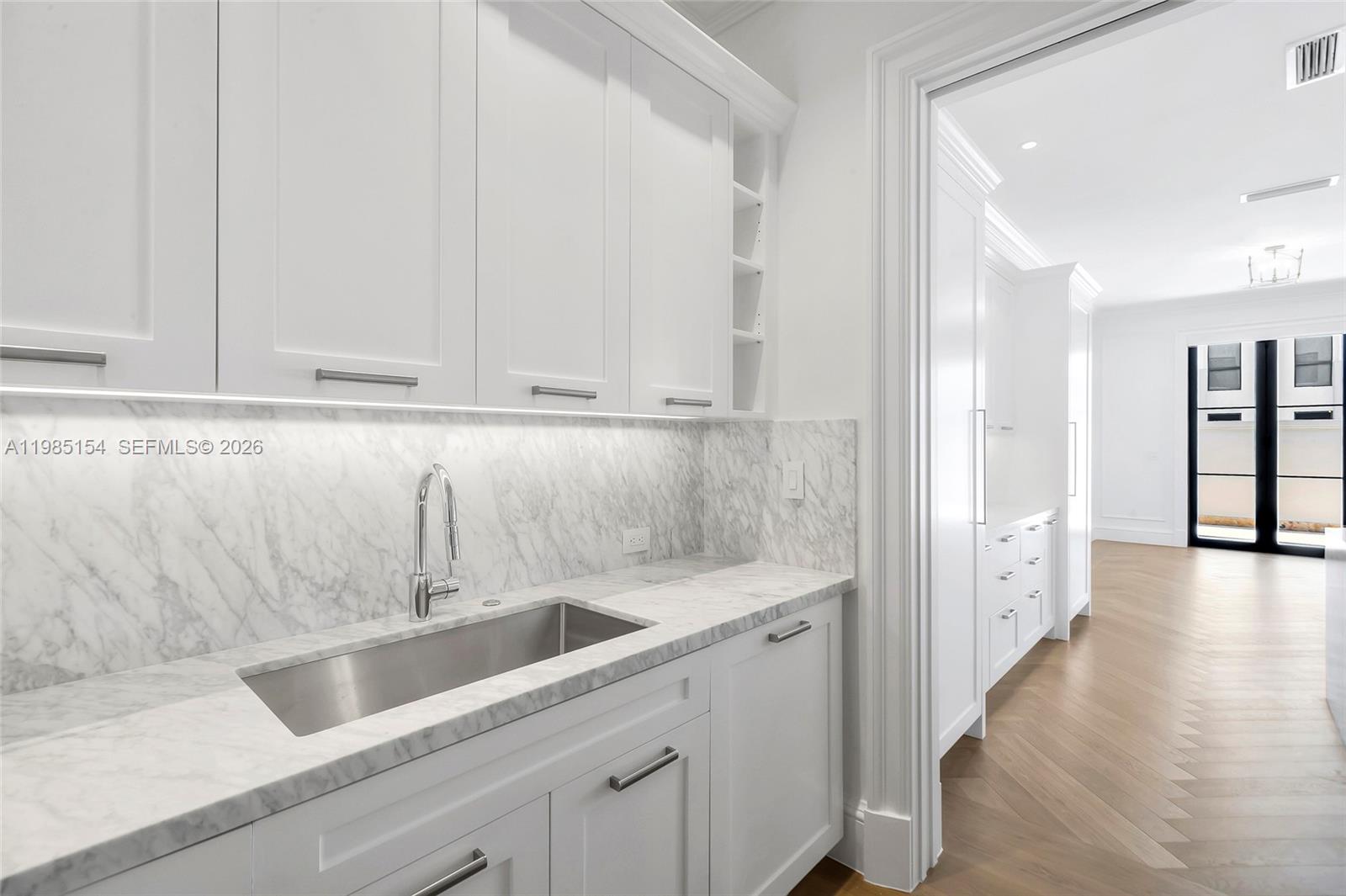 2613 Anderson Road, Unit 2613 Coral Gables, FL 33134 - Photo 28 of 96 a kitchen with a sink and cabinets