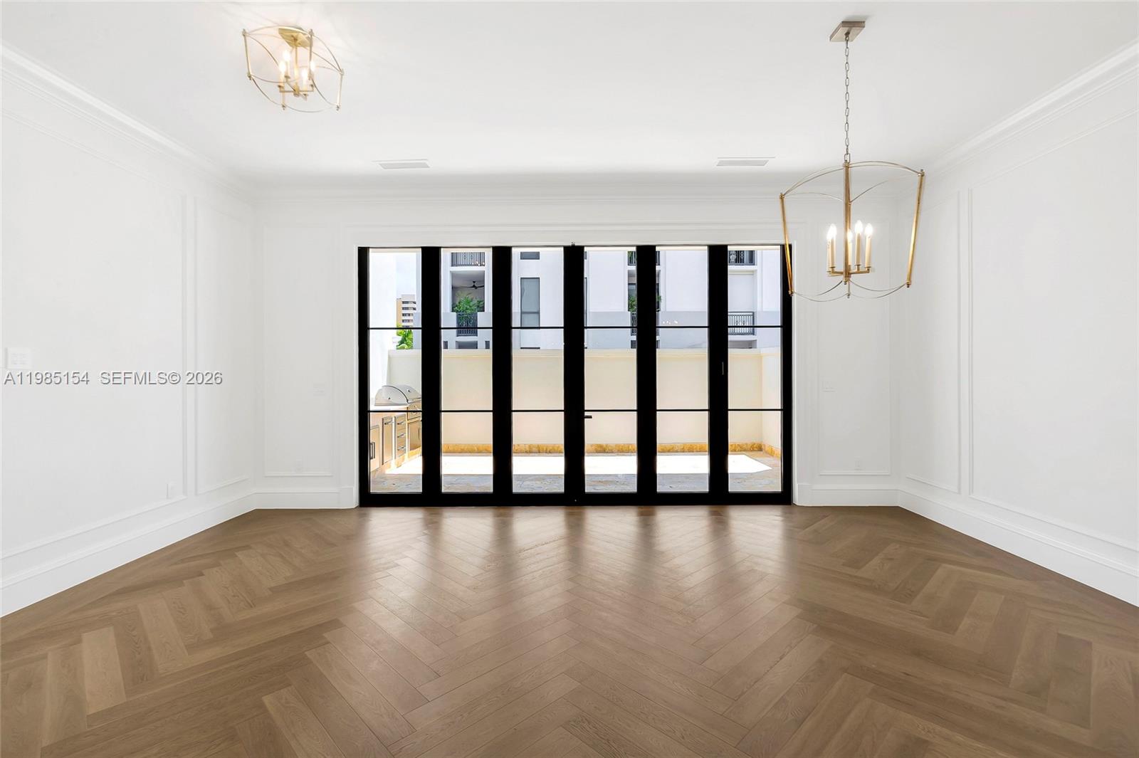 2613 Anderson Road, Unit 2613 Coral Gables, FL 33134 - Photo 39 of 96 a view of an empty room with window and hardwood floor