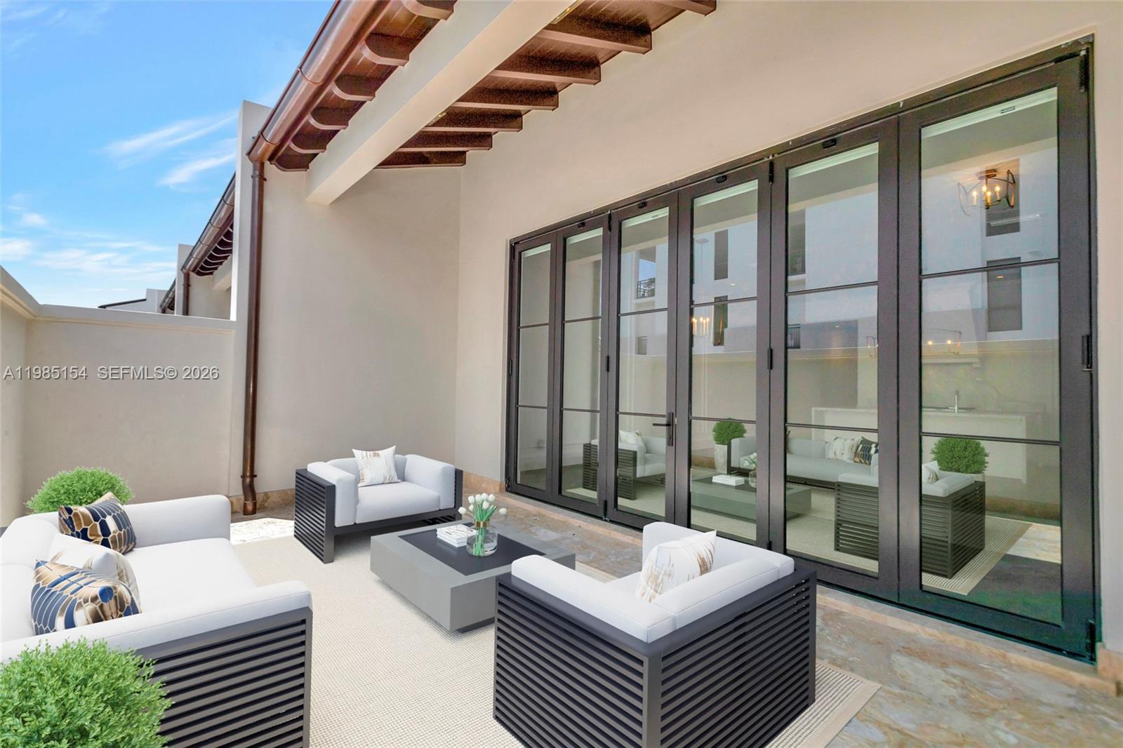 2613 Anderson Road, Unit 2613 Coral Gables, FL 33134 - Photo 44 of 96 a living room with furniture and a window