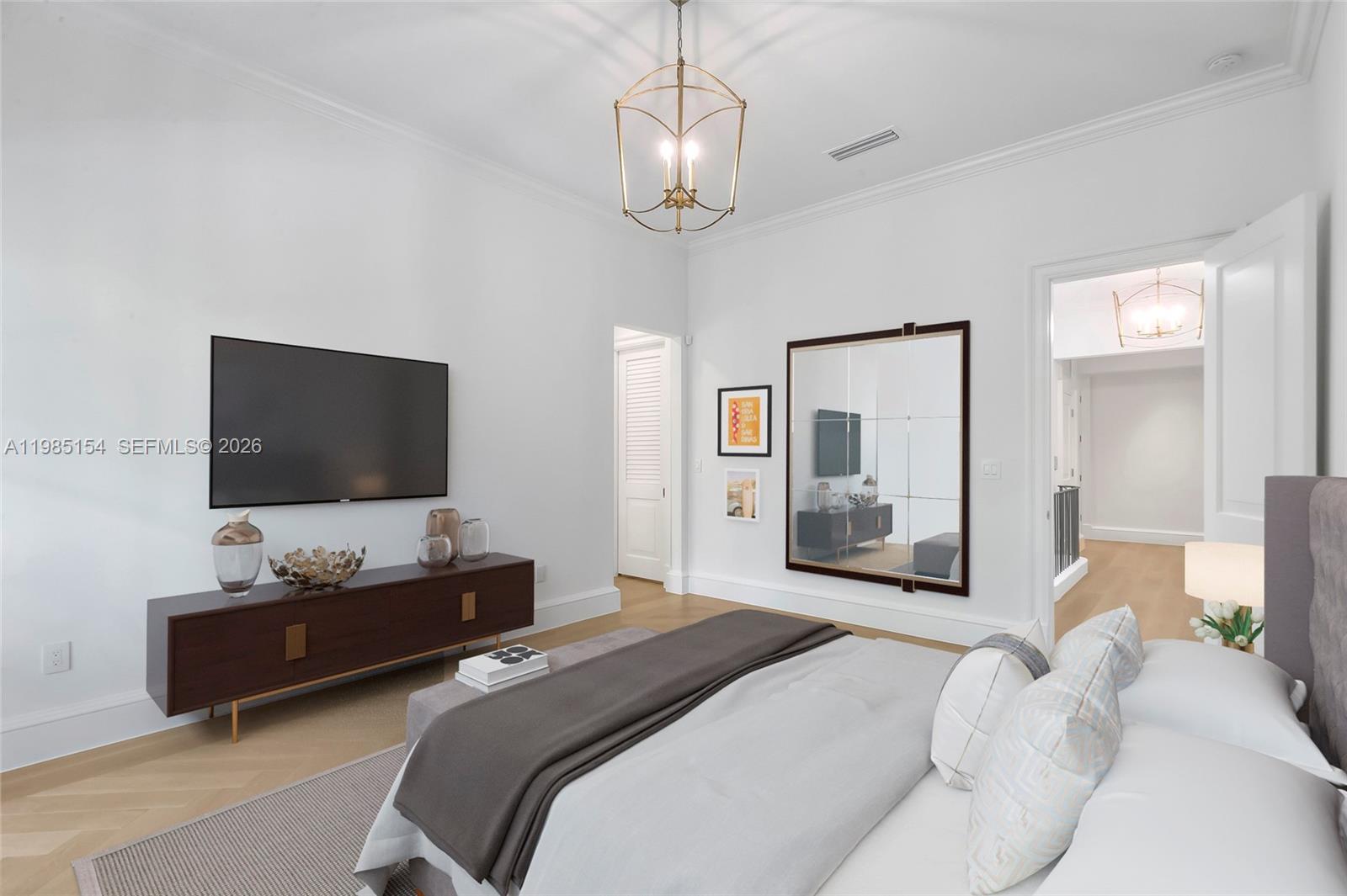 2613 Anderson Road, Unit 2613 Coral Gables, FL 33134 - Photo 65 of 96 a bedroom with a bed and a flat screen tv