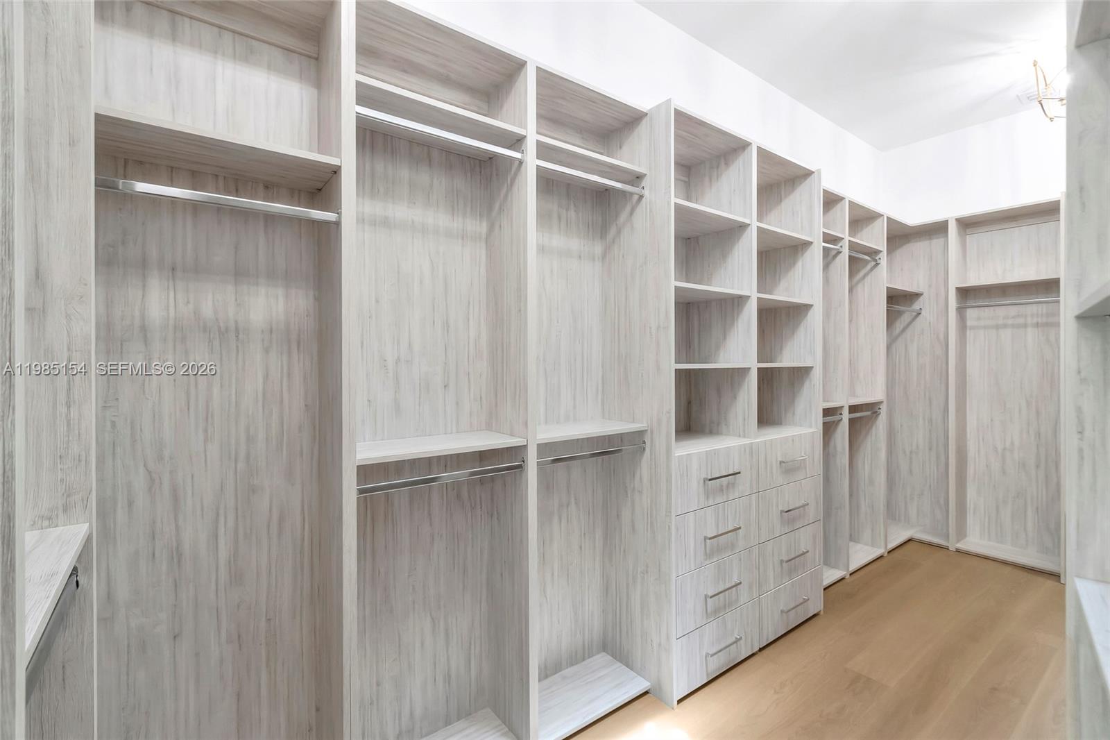 2613 Anderson Road, Unit 2613 Coral Gables, FL 33134 - Photo 71 of 96 a view of walk in closet with empty racks