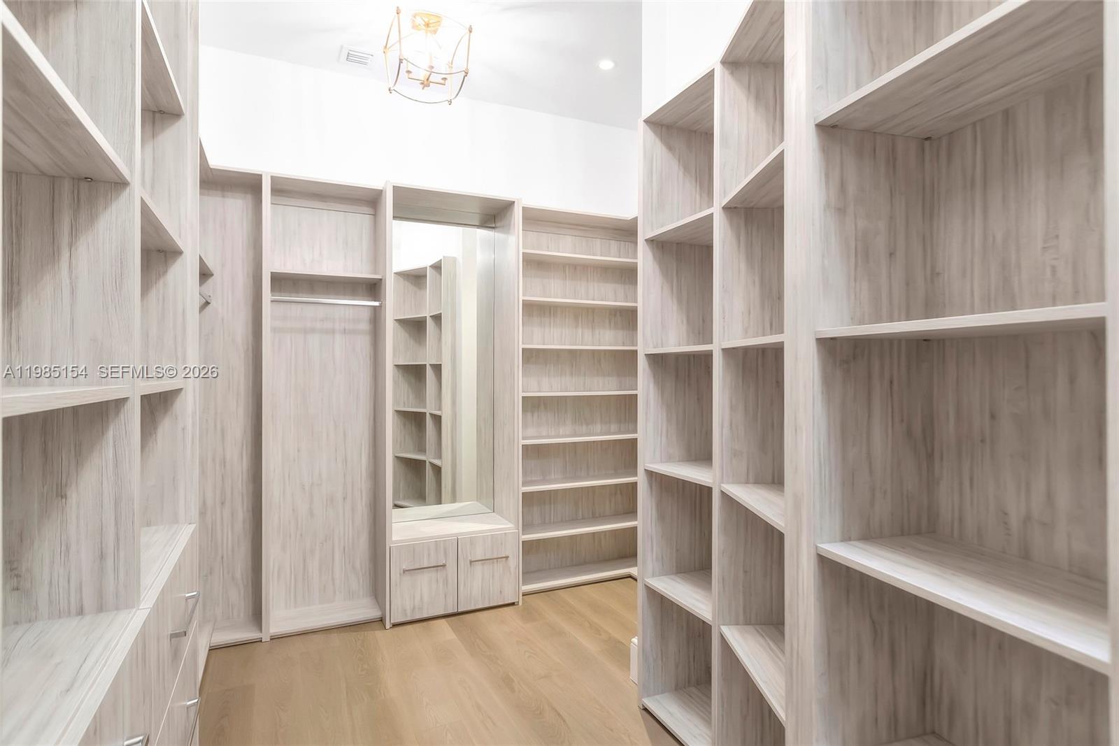 2613 Anderson Road, Unit 2613 Coral Gables, FL 33134 - Photo 72 of 96 a view of walk in closet with empty racks