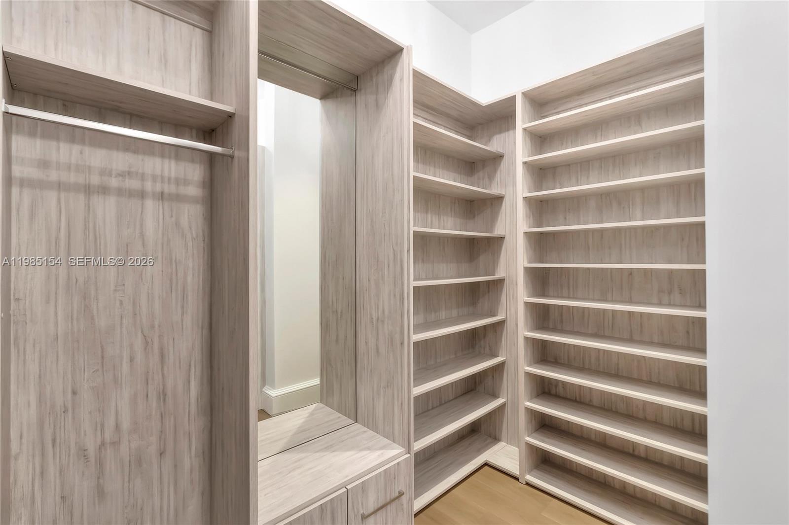 2613 Anderson Road, Unit 2613 Coral Gables, FL 33134 - Photo 73 of 96 a view of walk in closet with empty racks