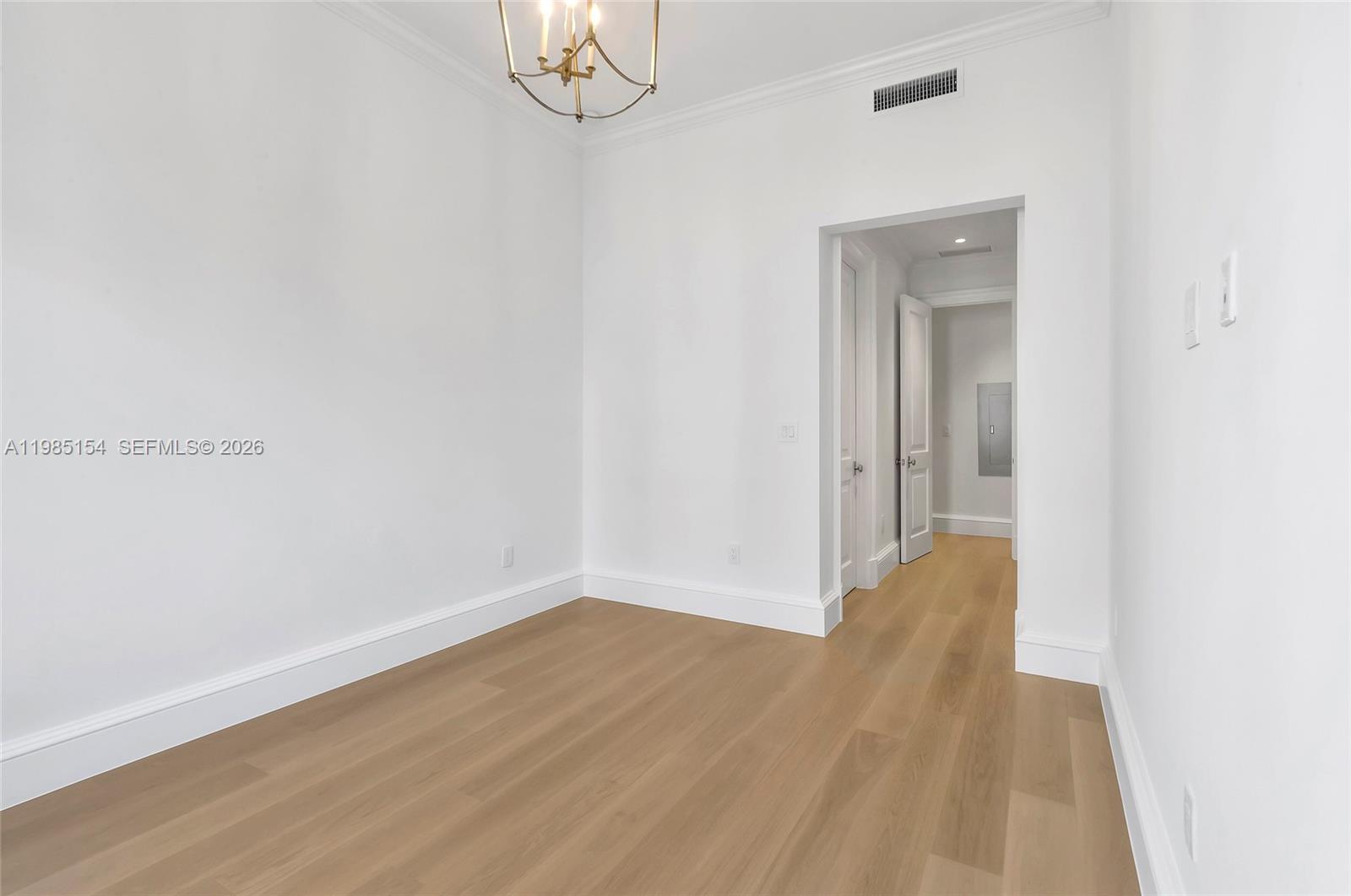 2613 Anderson Road, Unit 2613 Coral Gables, FL 33134 - Photo 79 of 96 a view of a room with wooden floor and a window