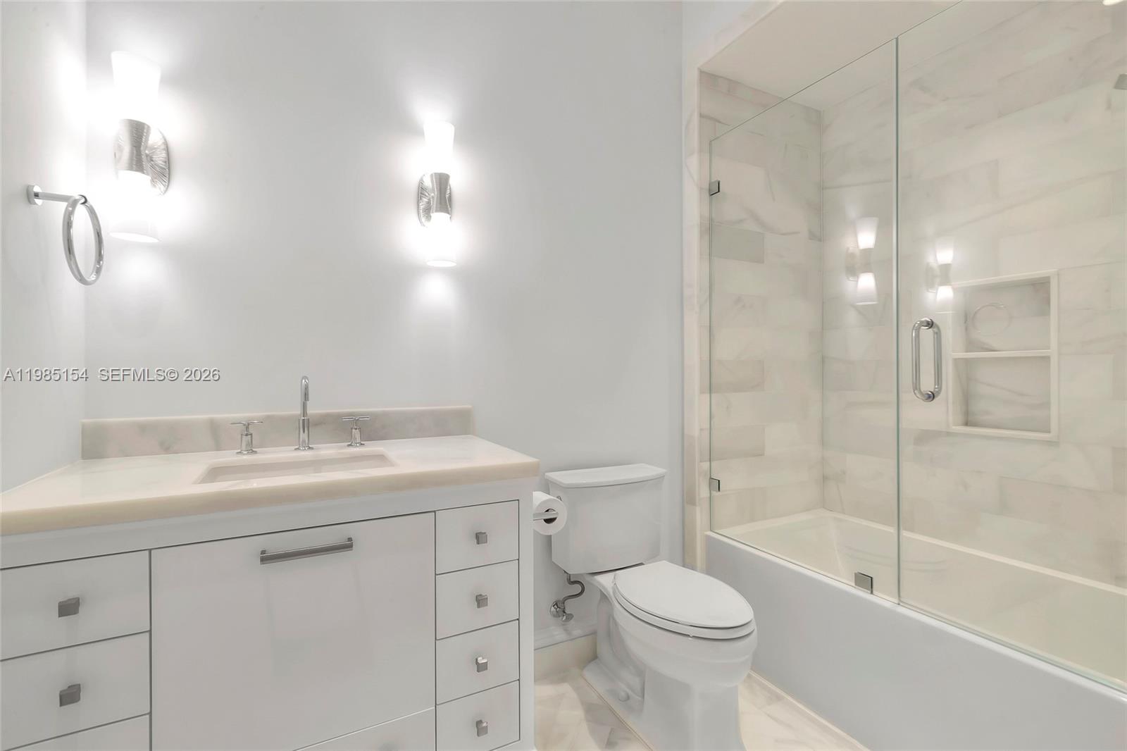 2613 Anderson Road, Unit 2613 Coral Gables, FL 33134 - Photo 80 of 96 a bathroom with a sink a toilet and a bathtub