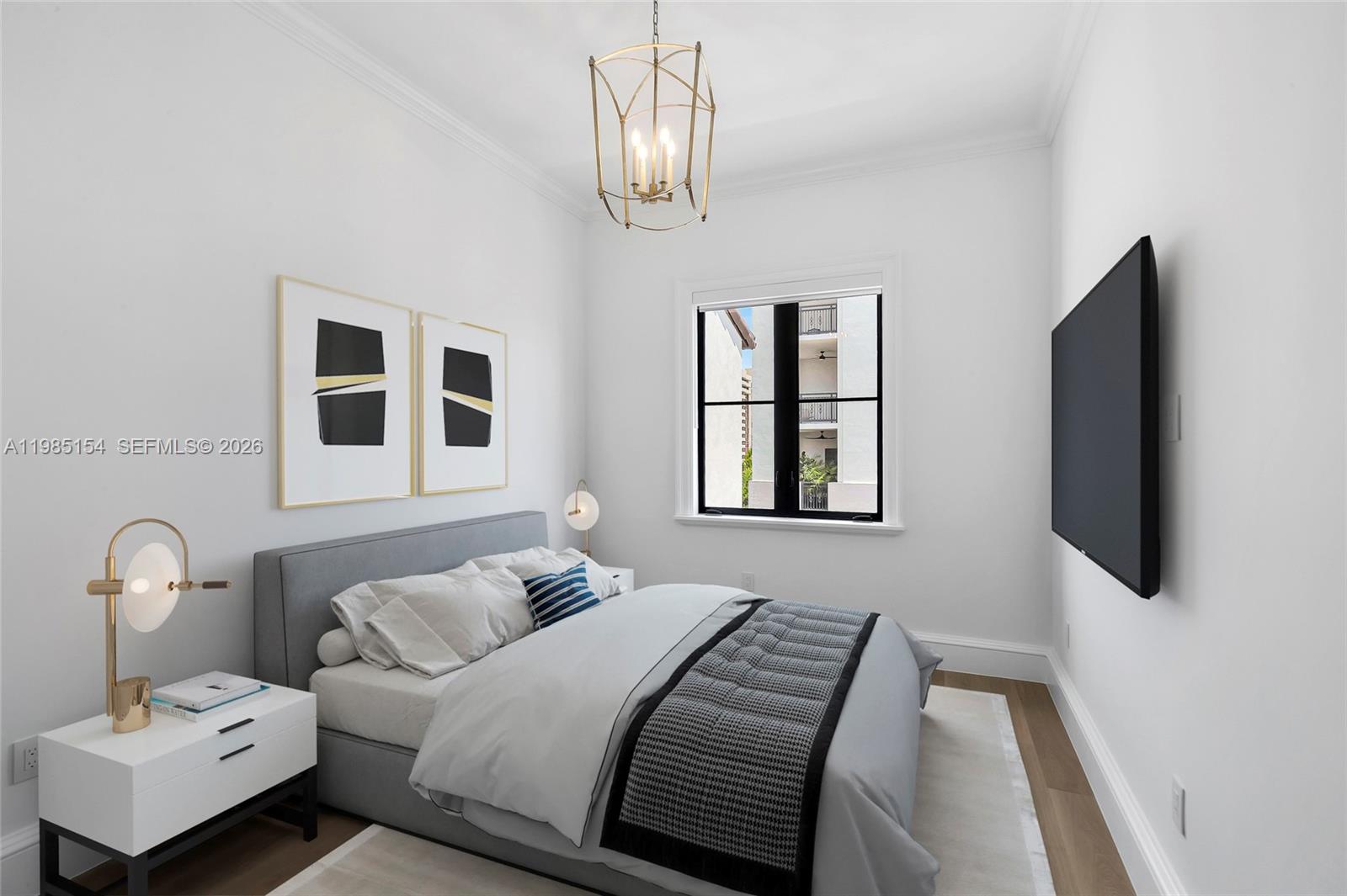 2613 Anderson Road, Unit 2613 Coral Gables, FL 33134 - Photo 81 of 96 a bedroom with a bed and a flat screen tv