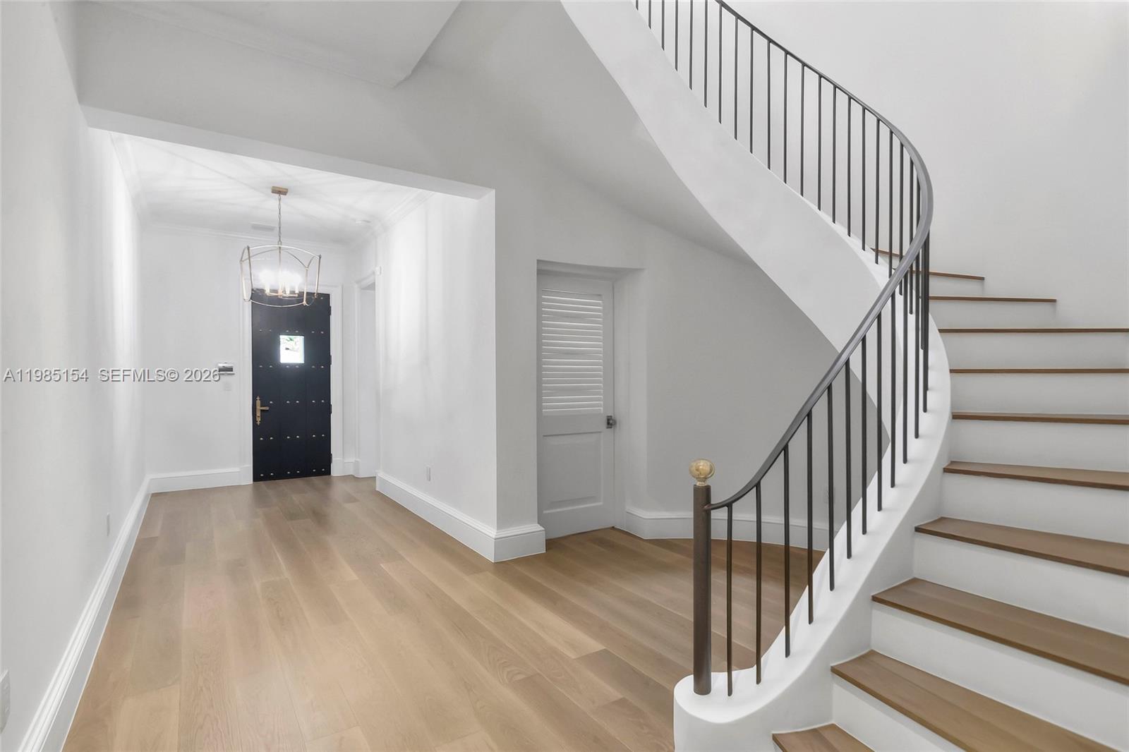 2613 Anderson Road, Unit 2613 Coral Gables, FL 33134 - Photo 10 of 96 a view of a hallway with wooden floor and entryway