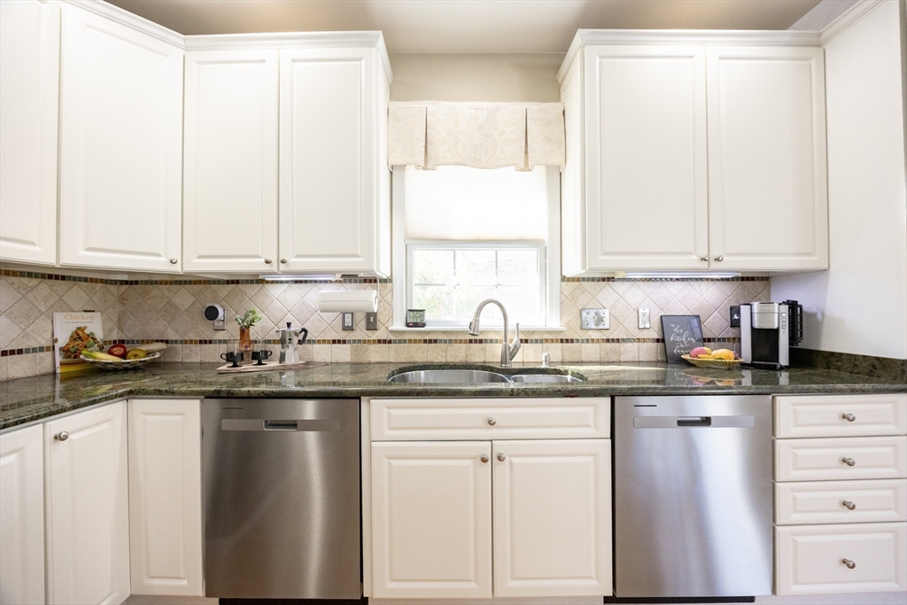 48 Laurel Drive Hudson, MA 01749 - Photo 12 of 42 a kitchen with granite countertop white cabinets and sink