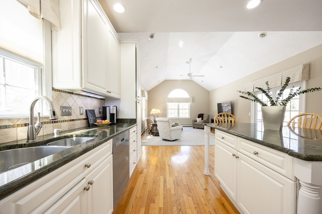 48 Laurel Drive Hudson, MA 01749 - Photo 15 of 42 a large white kitchen with lots of counter space a sink and a large window