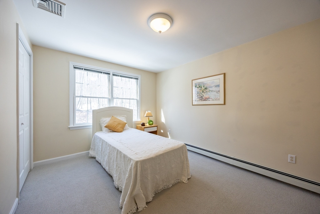48 Laurel Drive Hudson, MA 01749 - Photo 22 of 42 a bedroom with a bed and window