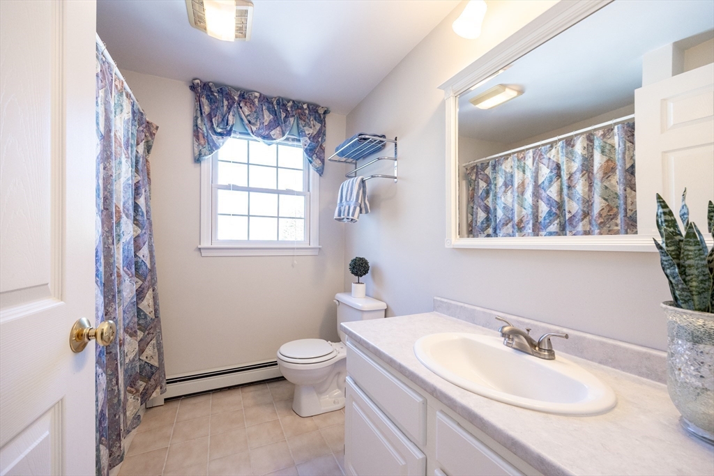 48 Laurel Drive Hudson, MA 01749 - Photo 23 of 42 a bathroom with a sink toilet and a mirror