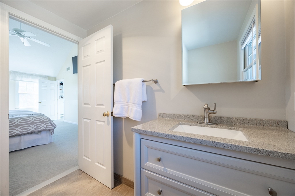 48 Laurel Drive Hudson, MA 01749 - Photo 28 of 42 a en suite bathroom with a granite countertop sink and mirror
