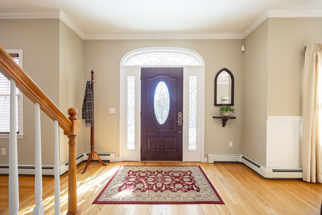 48 Laurel Drive Hudson, MA 01749 - Photo 3 of 42 a view of an entryway with wooden floor and door