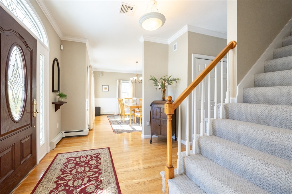 48 Laurel Drive Hudson, MA 01749 - Photo 4 of 42 a living room with furniture and a rug
