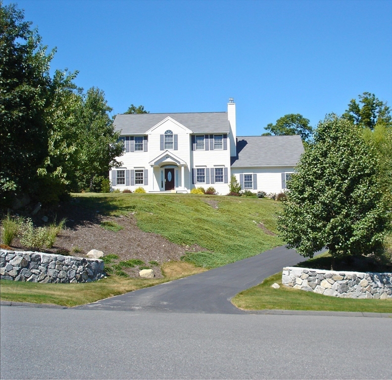 48 Laurel Drive Hudson, MA 01749 - Photo 41 of 42 a front view of a house with a yard