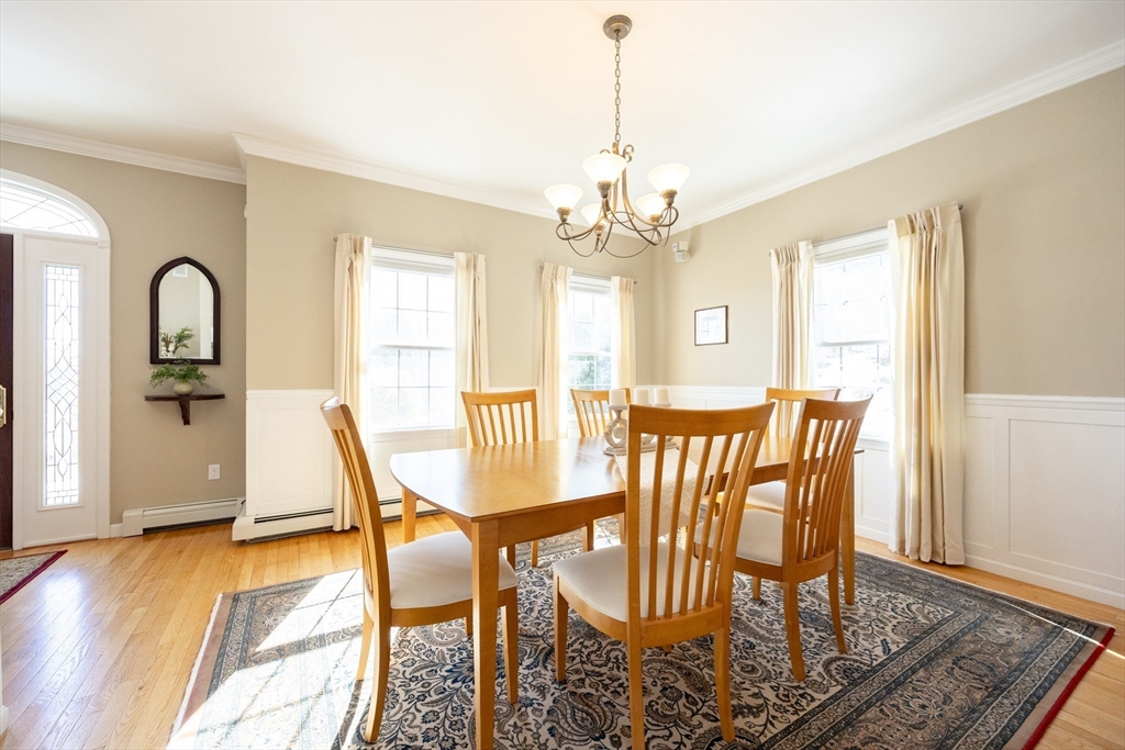 48 Laurel Drive Hudson, MA 01749 - Photo 5 of 42 a view of a dining room with furniture window and wooden floor